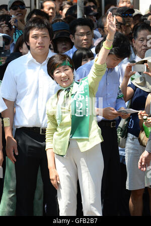 Tokyo, Japan. 30th July, 2016. Japan's former Defense Minister Yuriko Koike (front) attends an election campaign in Tokyo, capital of Japan, on July 30, 2016. Former Defense Minister Yuriko Koike is set to win Tokyo gubernatorial race on Sunday, exit polls by local media showed. The 64-year-old former TV anchorwoman will become Tokyo's first female governor. © Ma Ping/Xinhua/Alamy Live News Stock Photo