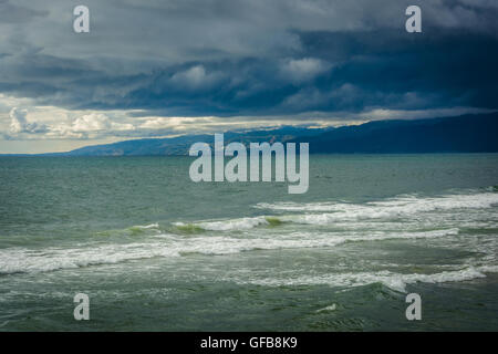 Storm clouds over Malibu and the Pacific Ocean, seen from Venice Beach, Los Angeles, California. Stock Photo