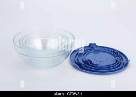 glass food container with blue plastic lid isolated on white background Stock Photo