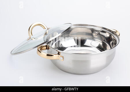 Stainless steel metal cooking pot pan over isolated white background Stock Photo