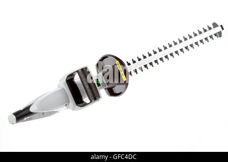 New cordless hedge trimmer isolated on plain background Stock Photo