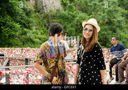 Travellers thai women travel and portrait at Love Lock Penang Hill zone on April 26, 2016 in Penang, Malaysia Stock Photo