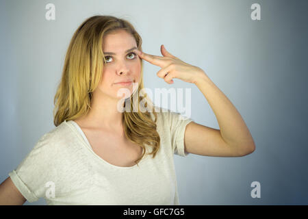 female model attractive woman on plein background with copy space shooting herself Stock Photo
