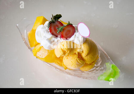 Mango Cheese Bingsoo or Shaved ice fruit and wipcream at restaurant in Malaysia Stock Photo
