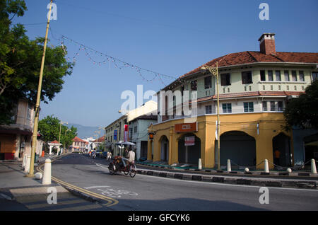 Malaysian people riding rickshaw service traveller tour around Georgetown city and street art area on April 27, 2016 in Penang, Stock Photo