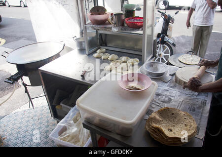 Resturant and people cooking roti mataba recipe and food malaysian style at Georgetown city and street art area in Penang, Malay Stock Photo