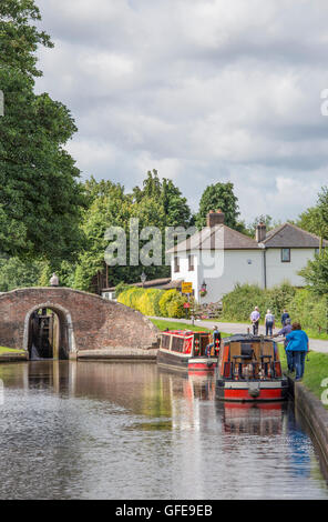 Narrowboats at Fradley Junction lock on the Trent and Mersey Canal, Staffordshire, England, UK Stock Photo