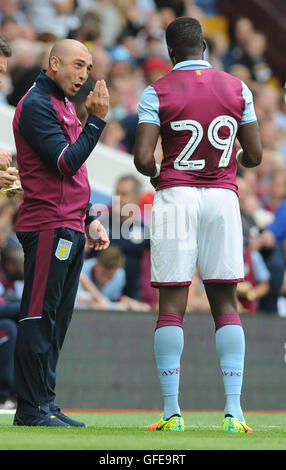 Aston Villa manager Roberto Di Matteo and Aston Villa's Aly Cissokho during the pre-season friendly match at Villa Park, Birmingham. Stock Photo