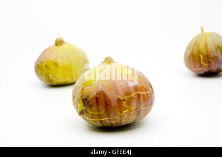 Three Fresh ripe figs on white background Stock Photo