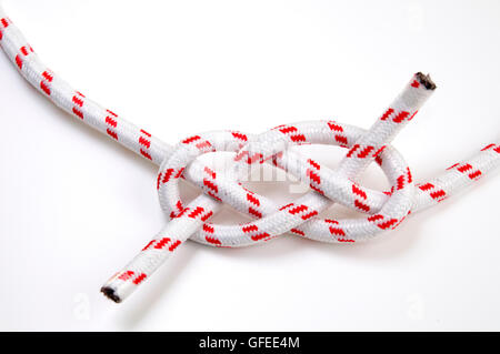 The Carrick Bend or The Josephine Knot AKA Sailor's Knot and Anchor Bend on white background Used to tie to lengths of rope toge Stock Photo