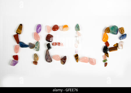 New age crystals and gemstones spelling out Help Stock Photo