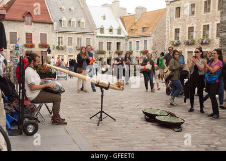 Quebec old city - Philippe Gagne - artist playing a Rav Drum based on a handpan (with didgeridoo) in Royal Square, Quebec Canada Stock Photo