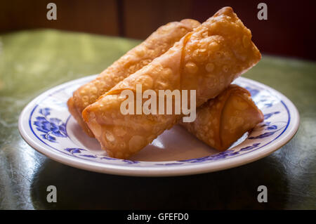 Chinese fried crispy egg rolls on fancy dinner plate Stock Photo