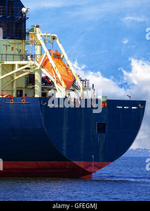 Lifeboat on the rear of a cargo ship. Stock Photo