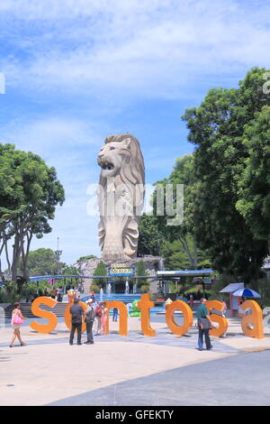 People take photos of Merlion in Sentosa Island in Singapore. Stock Photo