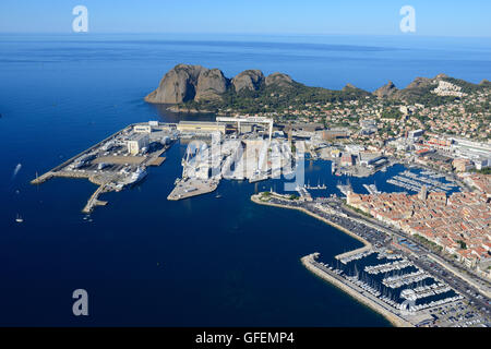 AERIAL VIEW. Modern shipyard and the old marina of La Ciotat. Bouches-du-Rhône, Provence, France. Stock Photo