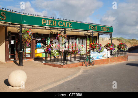 The seafront Victorian Pier, Fish and chips Cafe and Amusements at Lytham St Annes, near Blackpool, Lancashire, UK Stock Photo