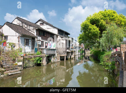 The buildings and water canals of Fengjing Town in Shanghai China on a sunny blue sky day. Stock Photo