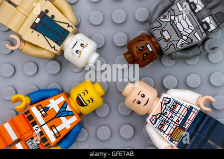 Tambov, Russian Federation - July 06, 2016 Four Lego minifigures with with different color heads and different emotions on faces Stock Photo