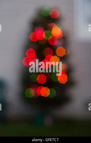 Multicolored Christmas lights and tree, soft focus abstract Stock Photo