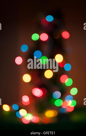 Multicolored Christmas lights and tree, soft focus abstract Stock Photo