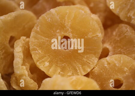Pineapple Slices, Pineapple Rings. Pile of candied pineapple slices, dehydrated pineapple rings, crystallized Pineapple, close up. Stock Photo