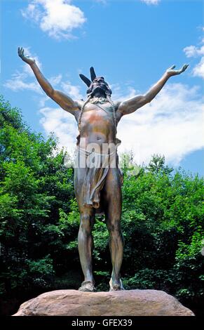On the Mohawk Trail near Charlemont, Massachusetts, USA. Bronze statue Hail to the Sunrise of native American Mohawk indian Stock Photo
