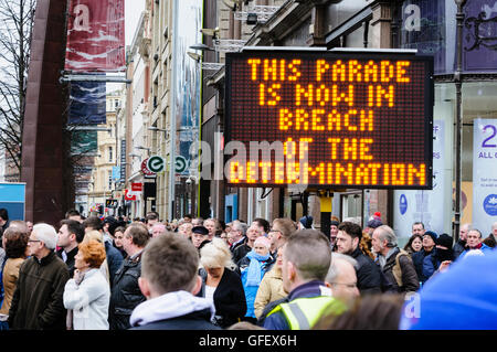 Belfast, Northern Ireland - 30th Nov 2013 - PSNI use illuminated signs to inform protesters that they are therefore in breach of Parades Commission Ruling after they fail to vacate a sensitive area by an allocated time. Stock Photo