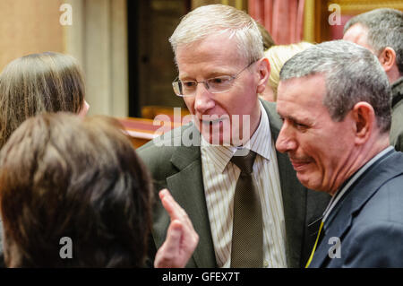Belfast, Northern Ireland. 10 Mar 2014 - Gregory Campbell (DUP) talks to survivors of IRA atrocities, including Alan McBride who lost his wife and mother in law during the Shankill Bomb of 1993, Senate Chamber, Parliament Buildings, Stormont. Stock Photo