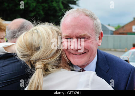 Belfast, Northern Ireland. 26 May 2014 -  Deputy First Minister Martin McGuinness smiles as he hugs colleague Michelle O'Neill Stock Photo