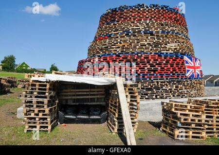 Ballyduff, Newtownabbey, Northern Ireland. 1 Jul 2014 - A controversial bonfire is built on a site which cost £30,000 of ratepayers money due to safety concerns in previous years.  Reports of tyres being used on the bonfire were shown to be false. Stock Photo