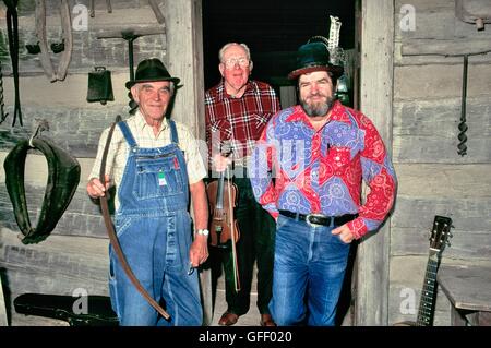 Traditional Bluegrass blue grass Appalachian folk musicians on cabin porch at the Museum of Appalachia at Norris Tennessee USA Stock Photo