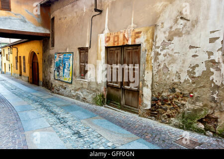 Closed old traditional bakery shop in a sett pavement alley at Rivoli, Turin, North Italy, Europe, European Union, EU. Stock Photo