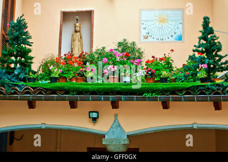 Weird garden on a roof, sundial meridian on the wall. Rivoli, Turin, Northern Italy, Europe, European Union, EU. Stock Photo