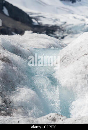 Small Glacial Melt Waterfall on Ice flows during summer Stock Photo