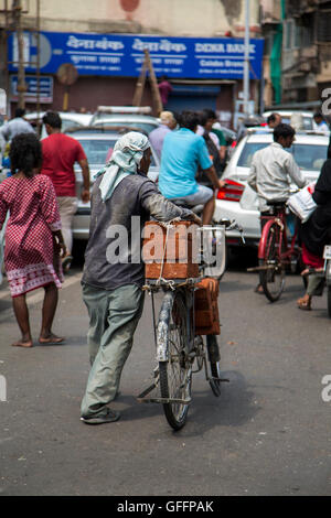 MUMBAI, INDIA - OCTOBER 10, 2015: Unidentified people on the street of Mumbai, India. With 12 million people, Mumbai is the most Stock Photo