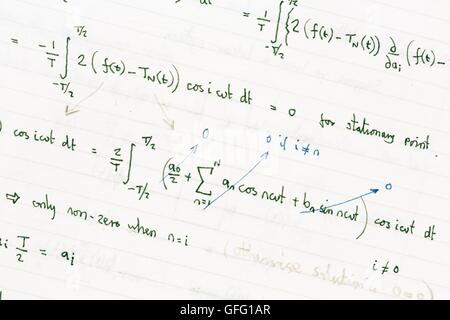 Maths homework showing handwritten mathematical formulae Stock Photo