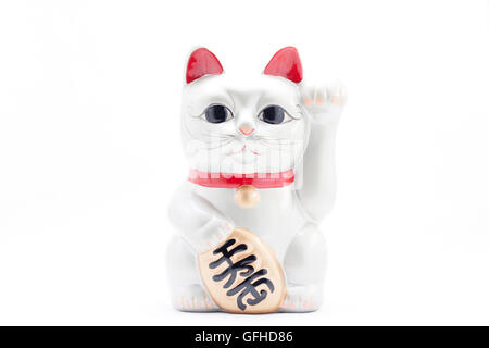 Japanese silver beckoning cat called Manekineko also known as a lucky cat Stock Photo