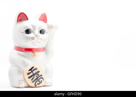 Japanese silver beckoning cat called Manekineko also known as a lucky cat Stock Photo