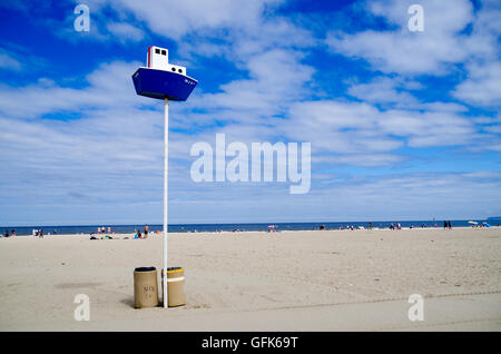 Empty Deauville beach in Normandy, France with a boat-shaped meeting point and sector marker Stock Photo