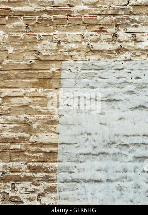 Old brick wall covered with color plaster Stock Photo