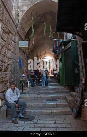 Jerusalem, Israel, Middle East: people in the alleys of the Old City, a walled area in which live together Muslims, Jews, Catholics and Armenians Stock Photo