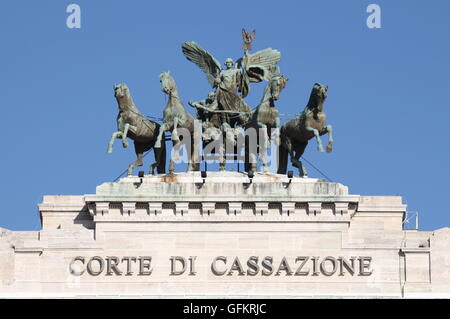 ROME - FEBRUARY 24: Statue of Fame driving the quadriga on top of Courthouse Palace on February 24, 2012 in Rome, Italy Stock Photo
