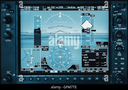 Airplane glass cockpit display G1000 with weather radar and engine gauges  in small private airplane Stock Photo