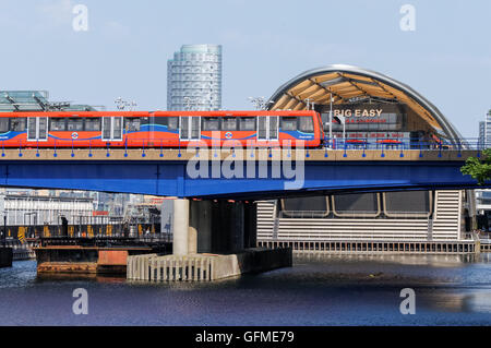 Docklands Light Railway train passing by Crossrail Place in London England United Kingdom UK Stock Photo