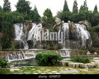 Replica of the Panlong Waterfall at the Chinese Ethnic Culture Park, Beijing – China. Stock Photo
