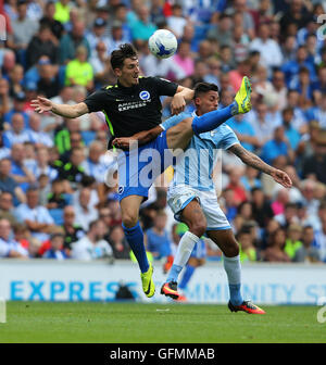 American Express Stadium, Brighton, Great Britain. 31st July 2016. Lewis Dunk ( L ) of Brighton and Hove Albion and Ricardo Kishna of Lazio challenge for the ball during a Pre-Season friendly match. Credit:  Tony Rogers/Alamy Live News Stock Photo