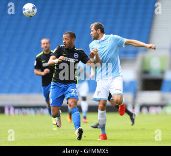 American Express Stadium, Brighton, Great Britain. 31st July 2016. Liam Rosenior ( left ) of Brighton and Hove Albion and Senad Lulic of Lazio challenge for the ball during a Pre-Season friendly match. Credit:  Paul Terry/Alamy Live News Stock Photo