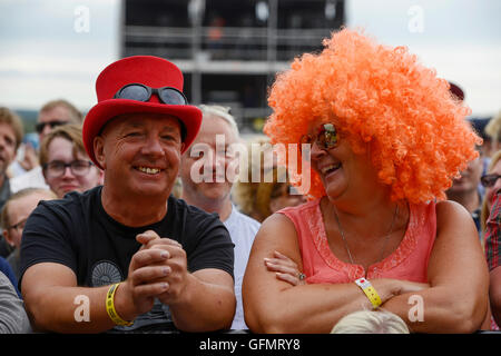 Carfest North, Bolesworth, Cheshire, UK. 31st July 2016. People enjoying the atmosphere around the Main stage. The theme for the final day of the festival is wigs. The event is the brainchild of Chris Evans and features 3 days of cars, music and entertainment with profits being donated to the charity Children in Need. Andrew Paterson/Alamy Live News Stock Photo