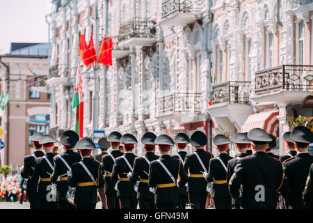 Back View Of Marching Formation Of Druming Cadet Guys From Gomel State Cadet School.  Ceremonial Parade Cortege Procession, Cele Stock Photo